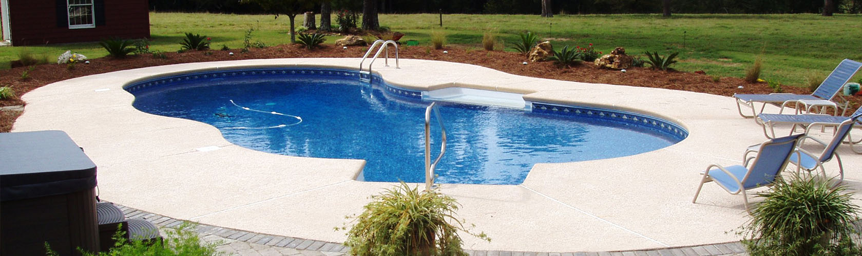 A newly installed in-ground pool with a garden.
